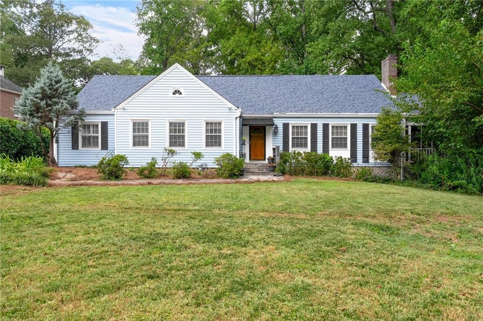 Single story home with a front yard