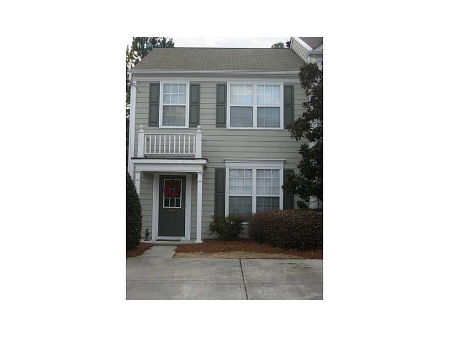 Exterior Front. Meticulously maintained end unit.