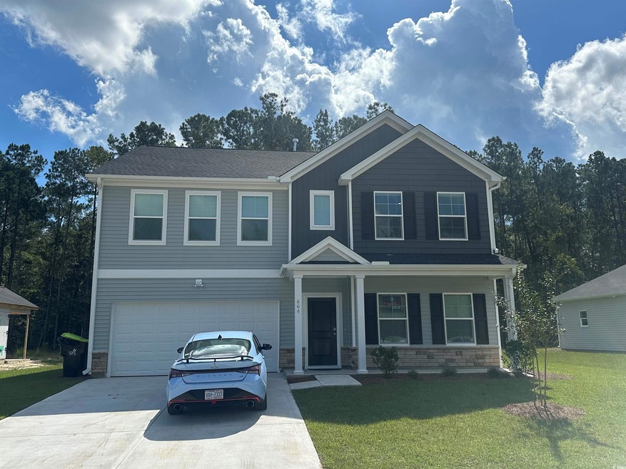 View of front of property with a front yard and a 