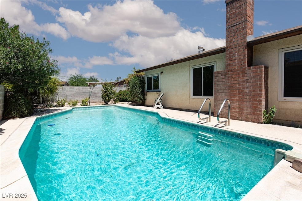 View of swimming pool featuring a fenced backyard