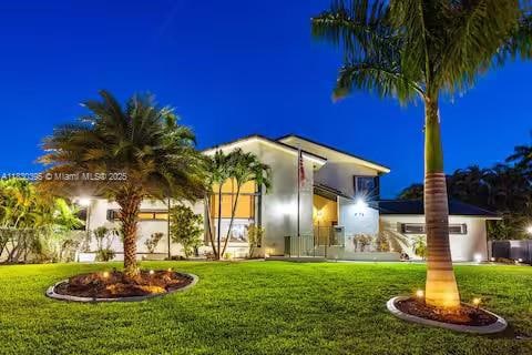 A tropical dream mansion glowing like it's ready for a beach party with the stars!