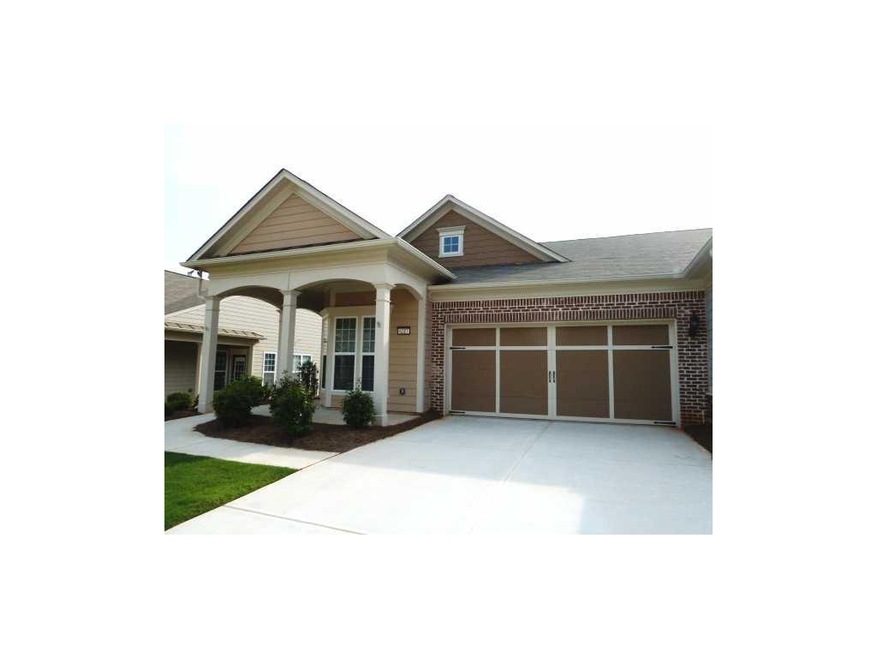 Exterior Front. Kenwood Villa model with 2 car Gar