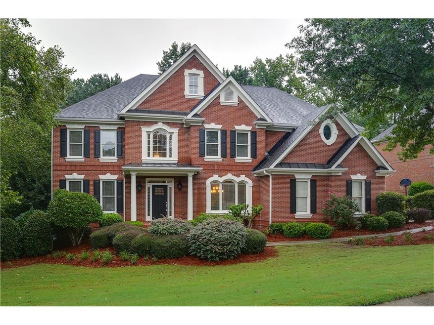 This brick beauty sits on a quiet 3-car garage lot