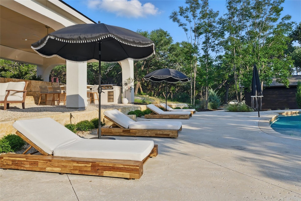 View of patio featuring an outdoor kitchen and a 