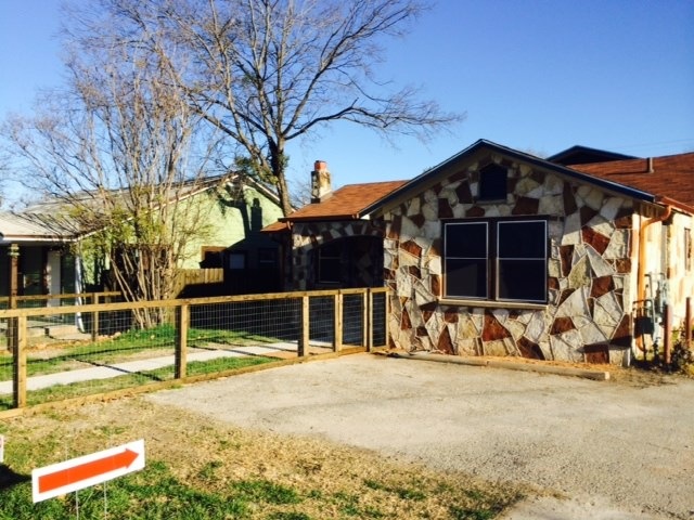Front of home with Fenced Yard