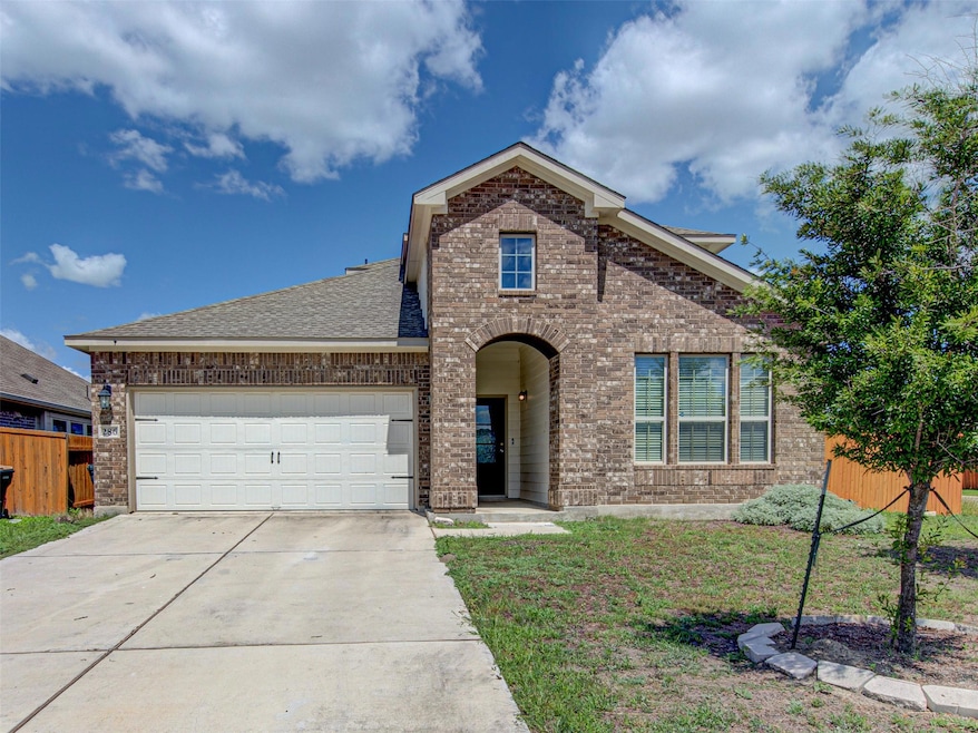 View of front of house featuring brick siding, co