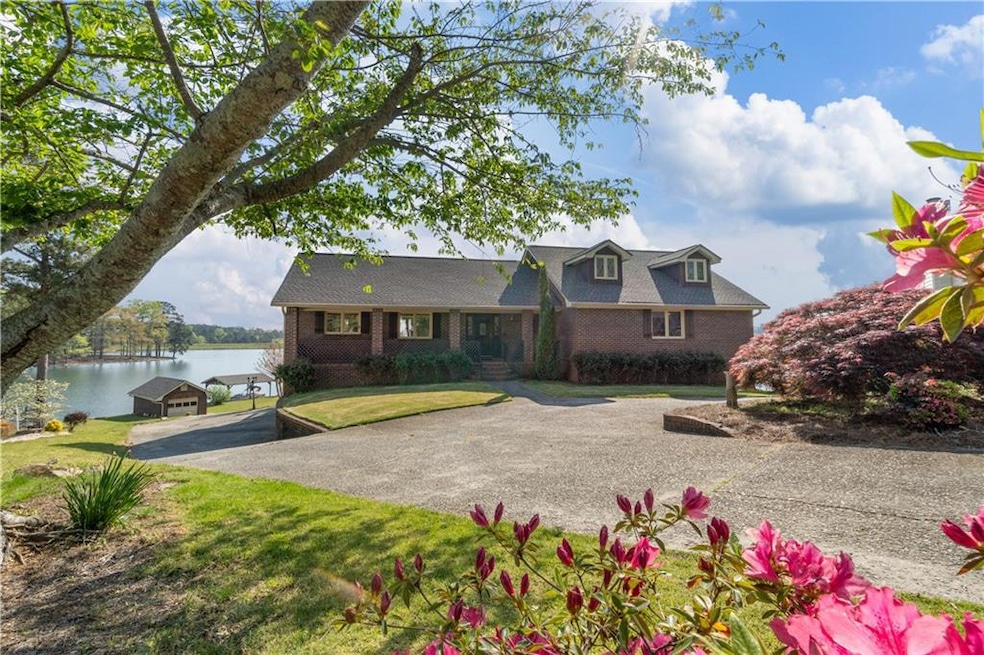View of front of house featuring a water view and a front yard