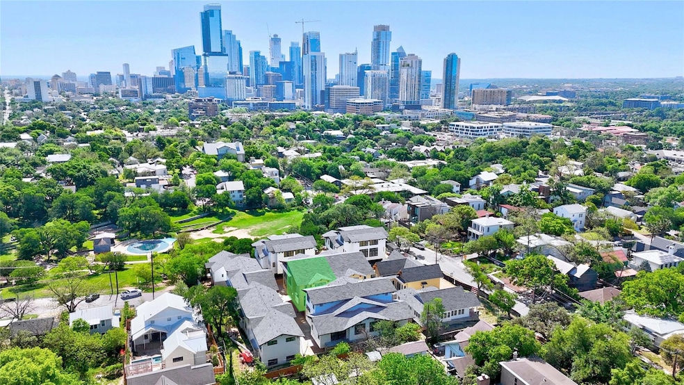 Aerial view featuring a view of city
