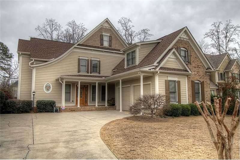Exterior Front. Custom Barry Holder home. Custom m
