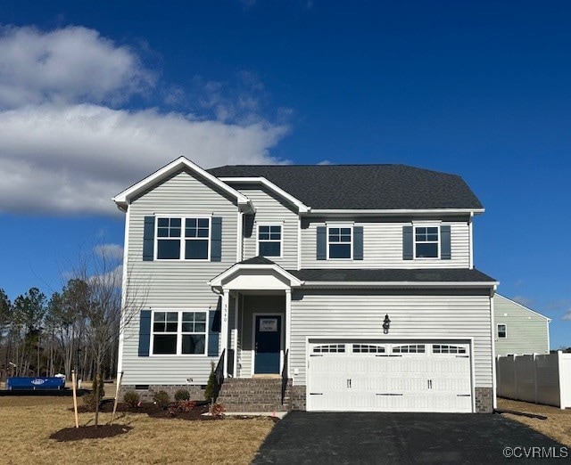 View of front of house with a garage