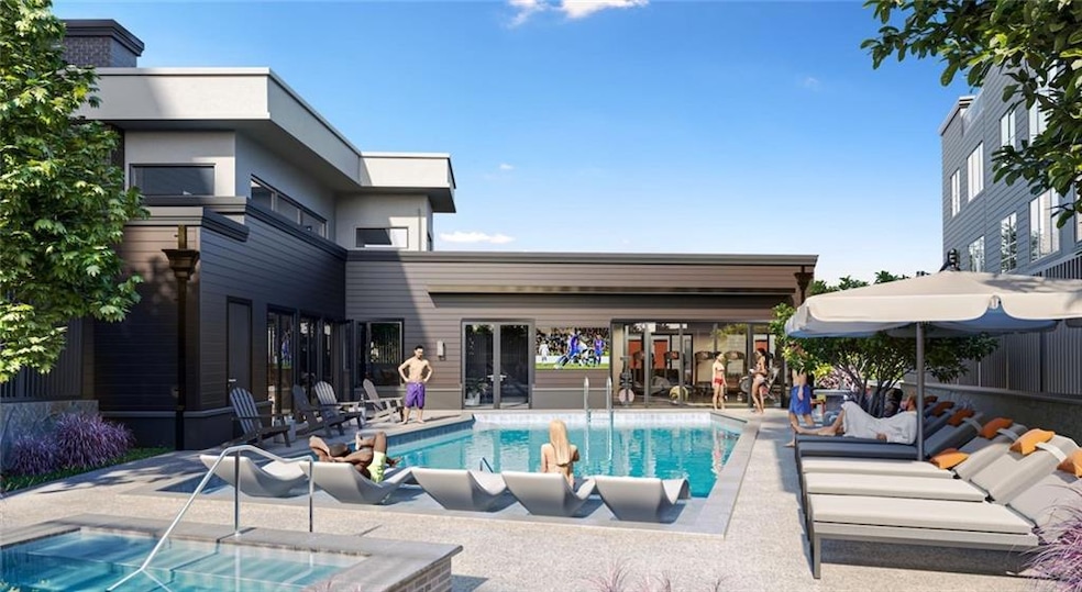 View of pool with a hot tub and a patio area
