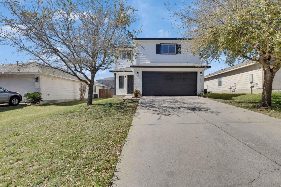 Traditional-style home featuring driveway, an att