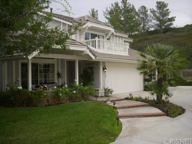Front of house demonstrating privacy, front porch, and balcony of the Master..