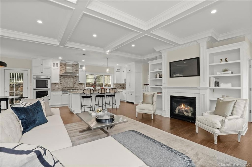 Family Room view to kitchen and gas fireplace