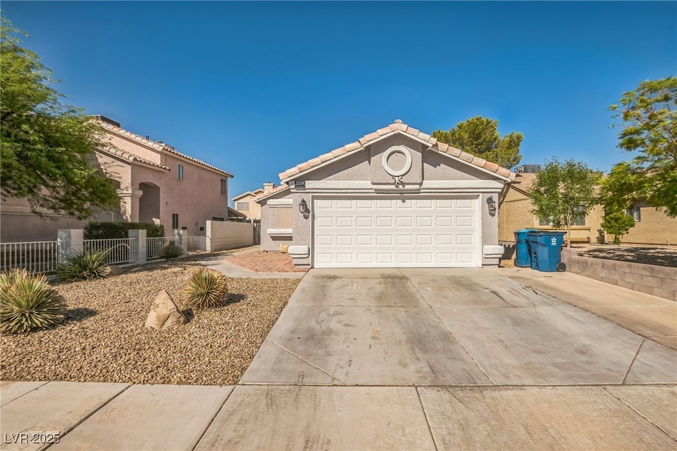 View of front facade featuring concrete driveway,
