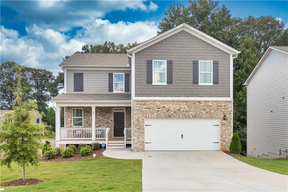 View of front of property featuring a garage, a fr
