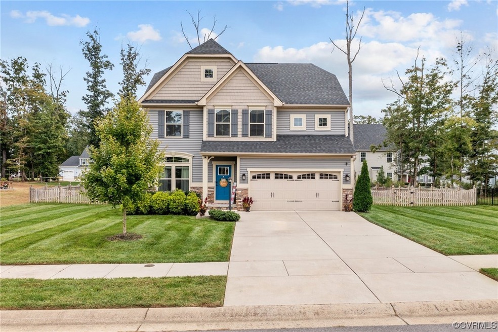 Craftsman-style home with a garage and a front yar