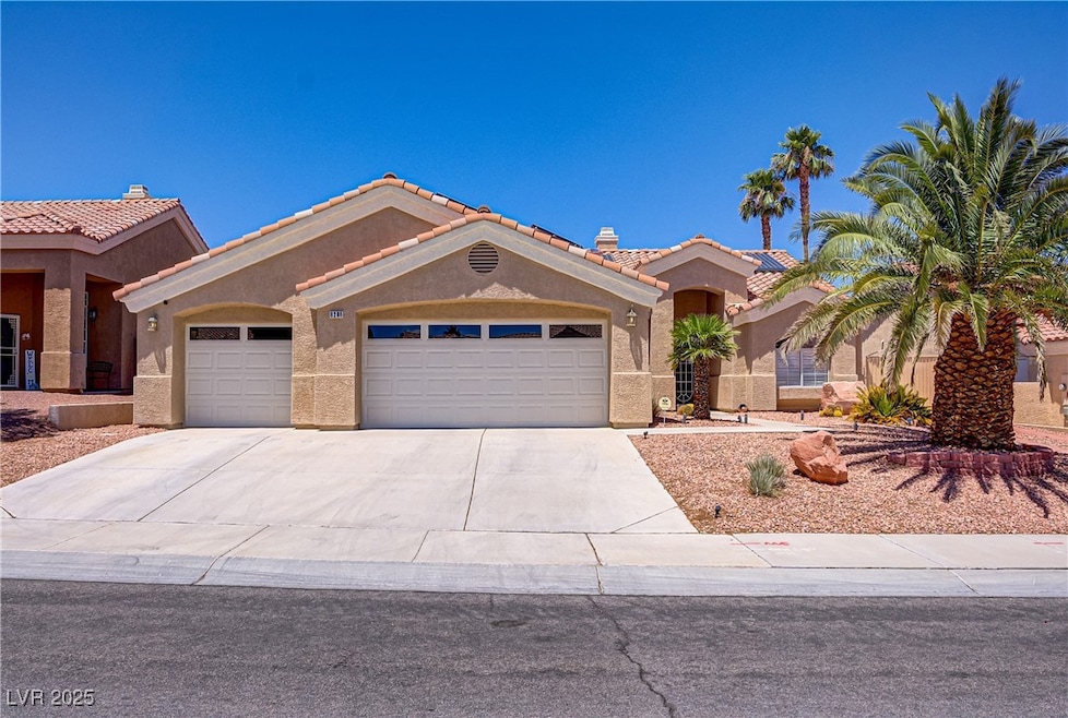 Mediterranean / spanish-style house with a garage,
