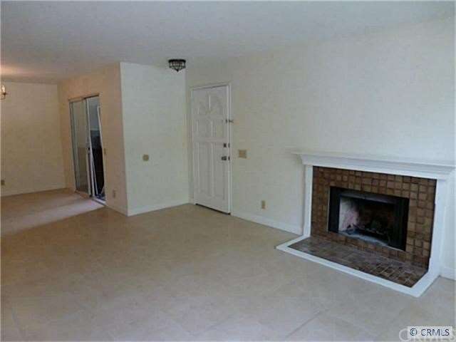 New travertine tile throughout