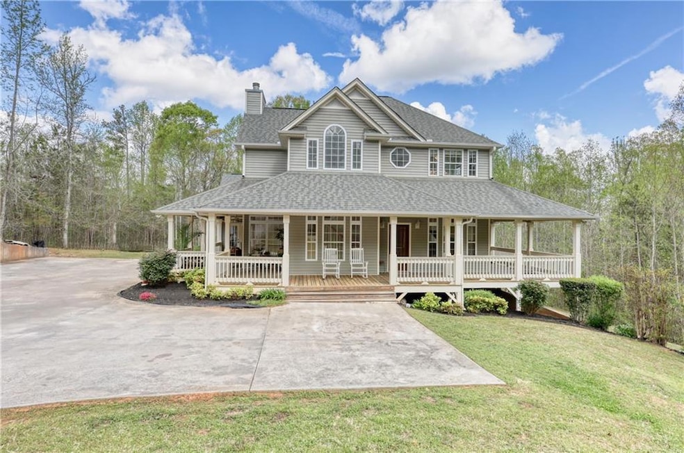 Farmhouse featuring a chimney, a front lawn, drive