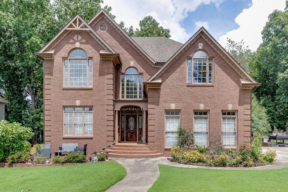 View of front of property with a front lawn and br