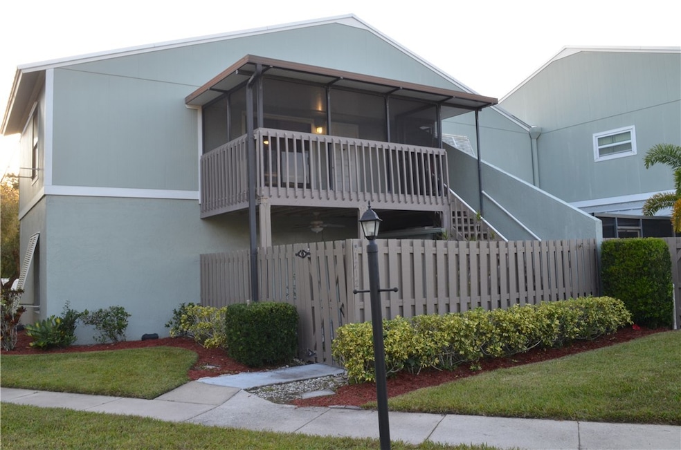 View of front facade with  siding and stairway