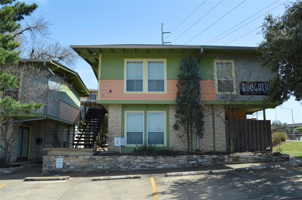 View of front of property with uncovered parking,