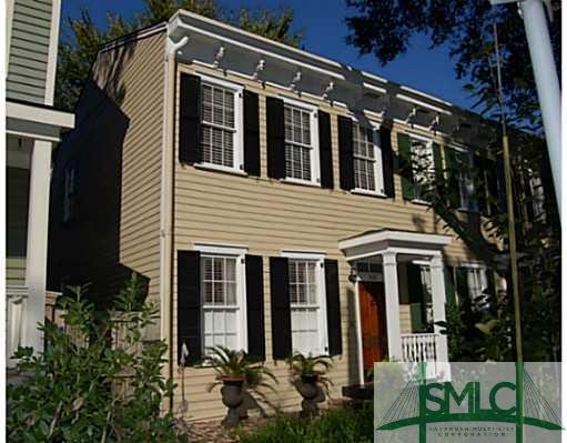 Exterior Front. On the end of a row in a beautiful
