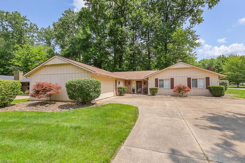 Single story home featuring garage and a front yar