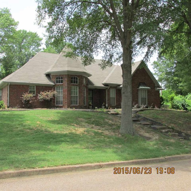 Pretty brick home with well landscaped yard.