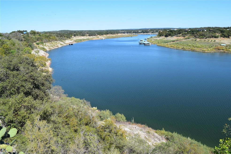 Aerial view of a nearby body of water and a forest