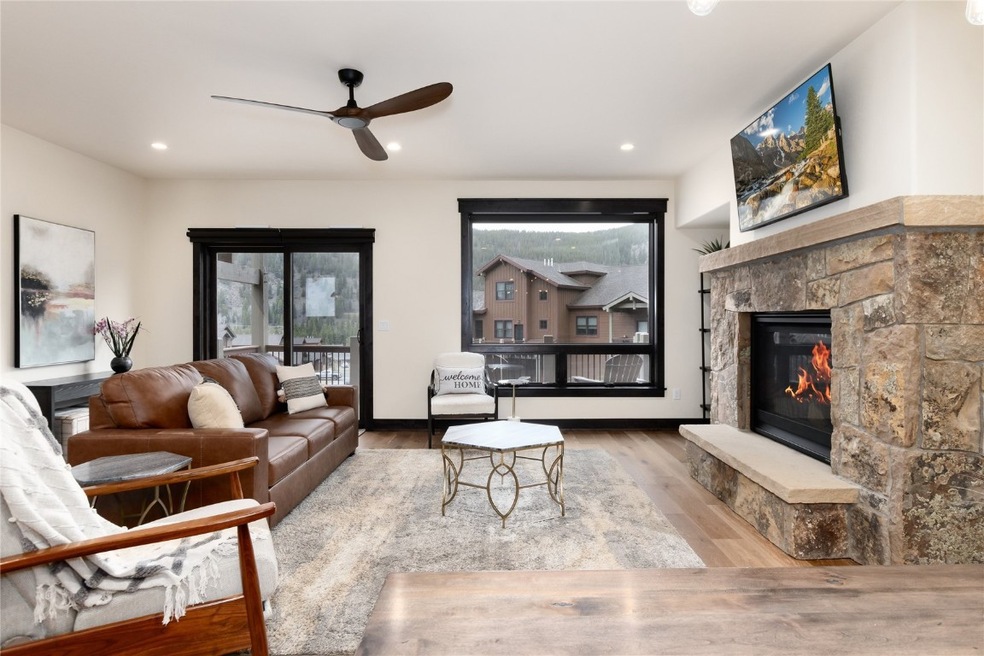 Living room with gas fireplace and large deck