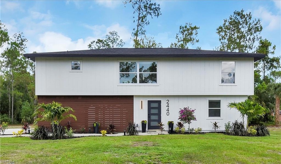 View of front of property with a garage and a fron
