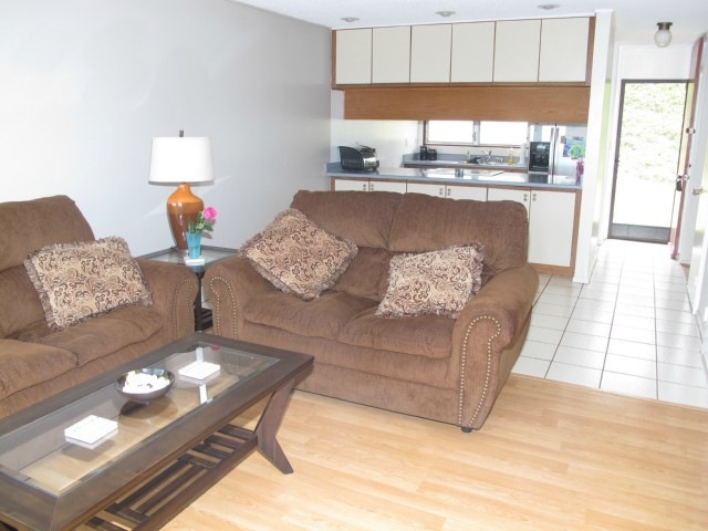 View of kitchen and back entrance from the living
