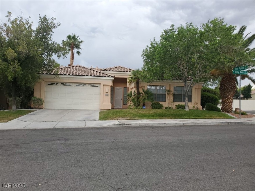 View of front of house featuring stucco siding, a