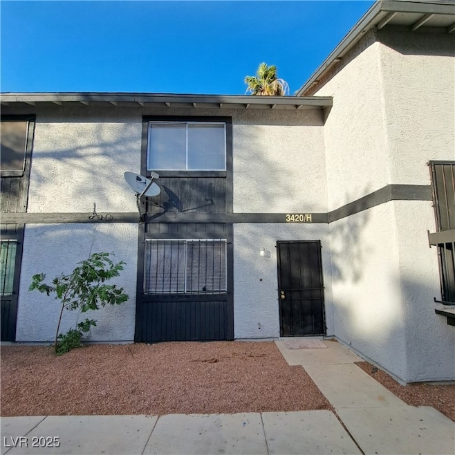 Doorway to property with stucco siding
