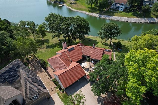 Aerial shot of house with lake background