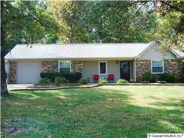 Front of home shows new vinyl, new roof and landscaped yard