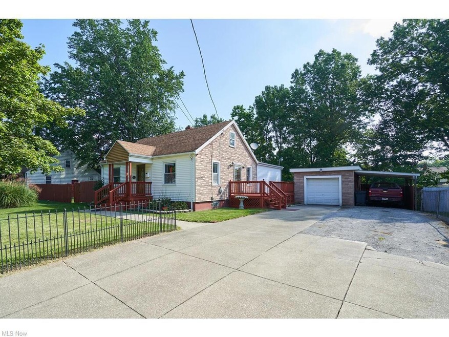 Bungalow-style home featuring garage and a front y