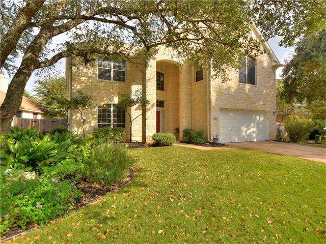 Towering Oak Trees grace the front entry and provide shade.