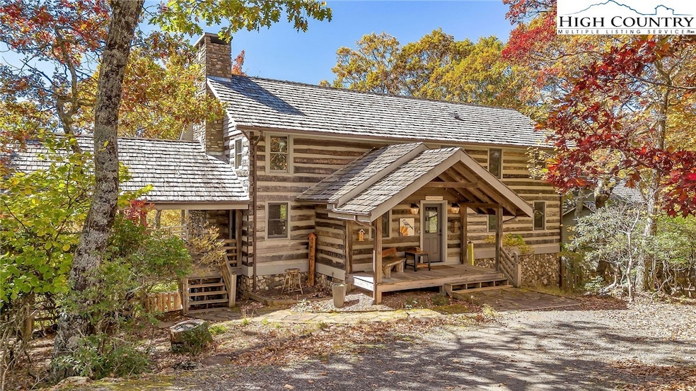 Step into a world of rustic charm with this antique log home,
uniquely positioned to offer
breathtaking views of the Blue Ridge Mountains.