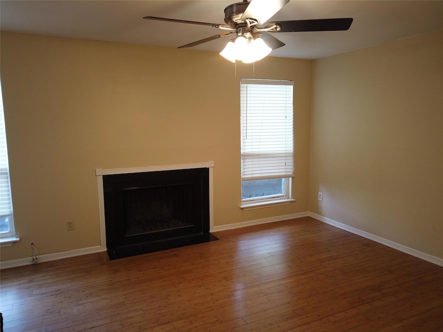 Unfurnished living room with a fireplace with flu