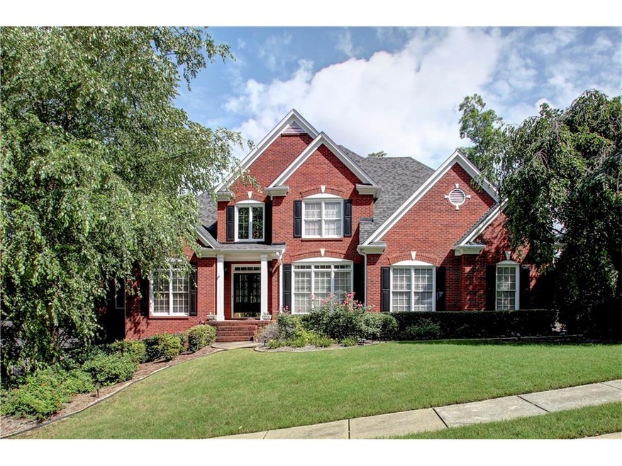 Elegant 3-sided brick home in prime East Cobb just