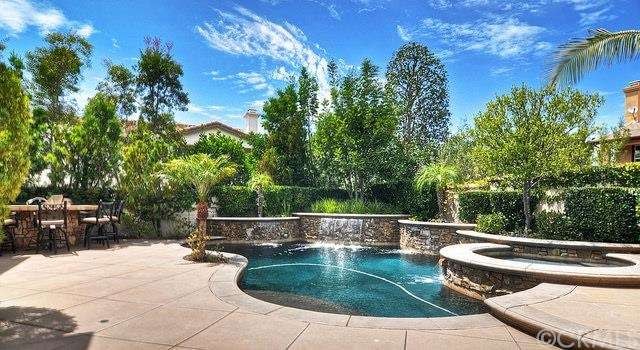 A great entertaining backyard with stacked stone f