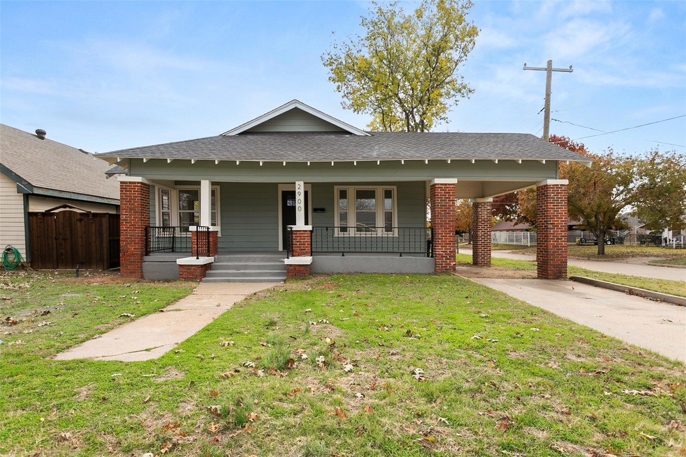 View of front of home with a porch and a front lawn