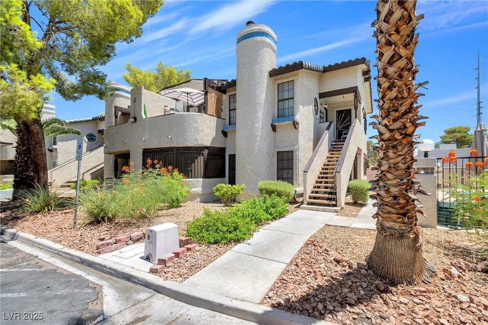 View of property featuring stairs