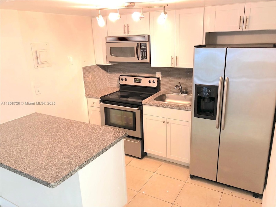 4301 NW South Tamiami Canal Dr unit 3-209, Miami, FL 33126 - photo 1