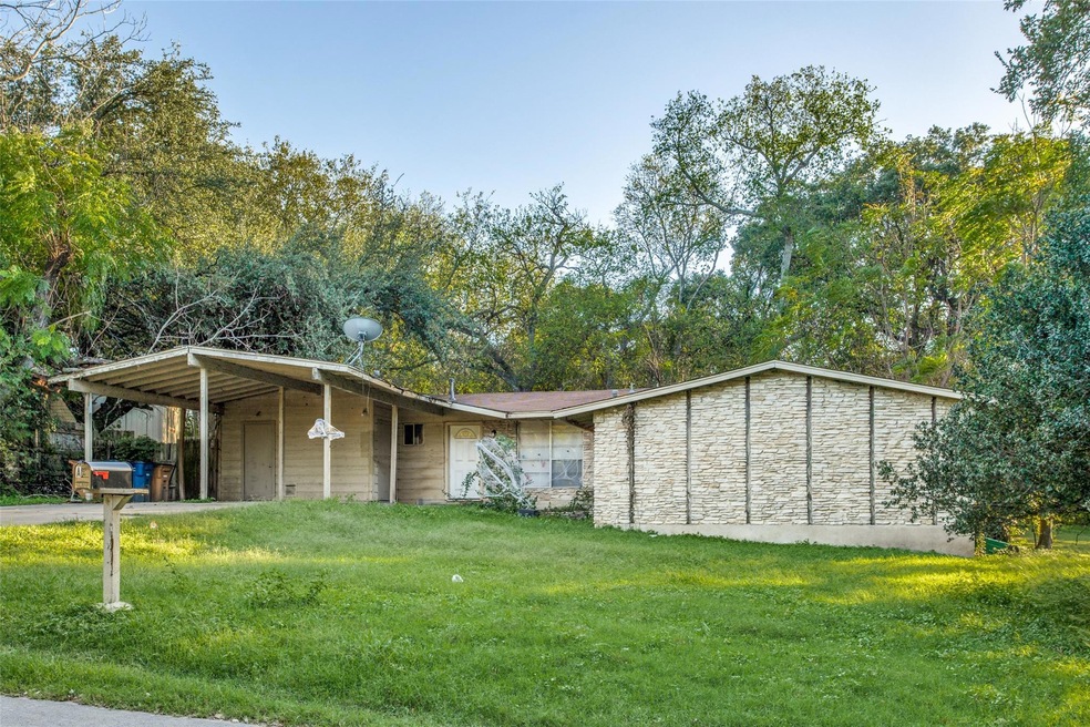 View of outdoor structure with a carport