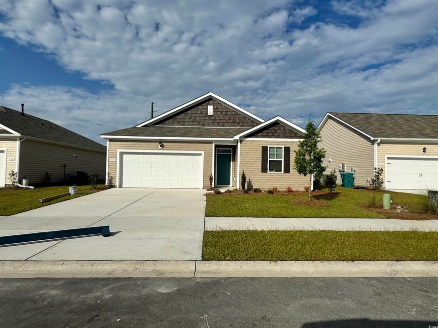 View of front of property featuring a garage and a