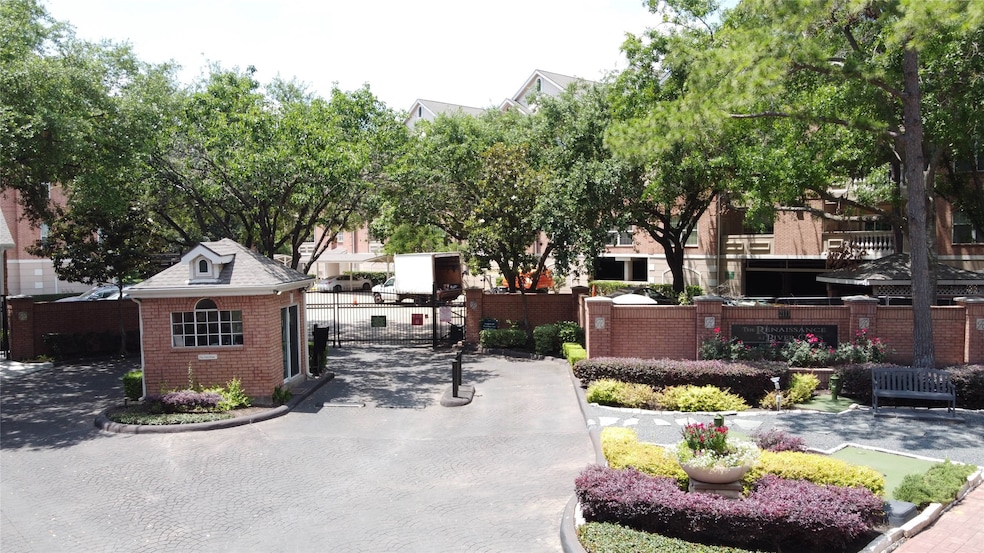 This photo showcases a gated community entrance wi